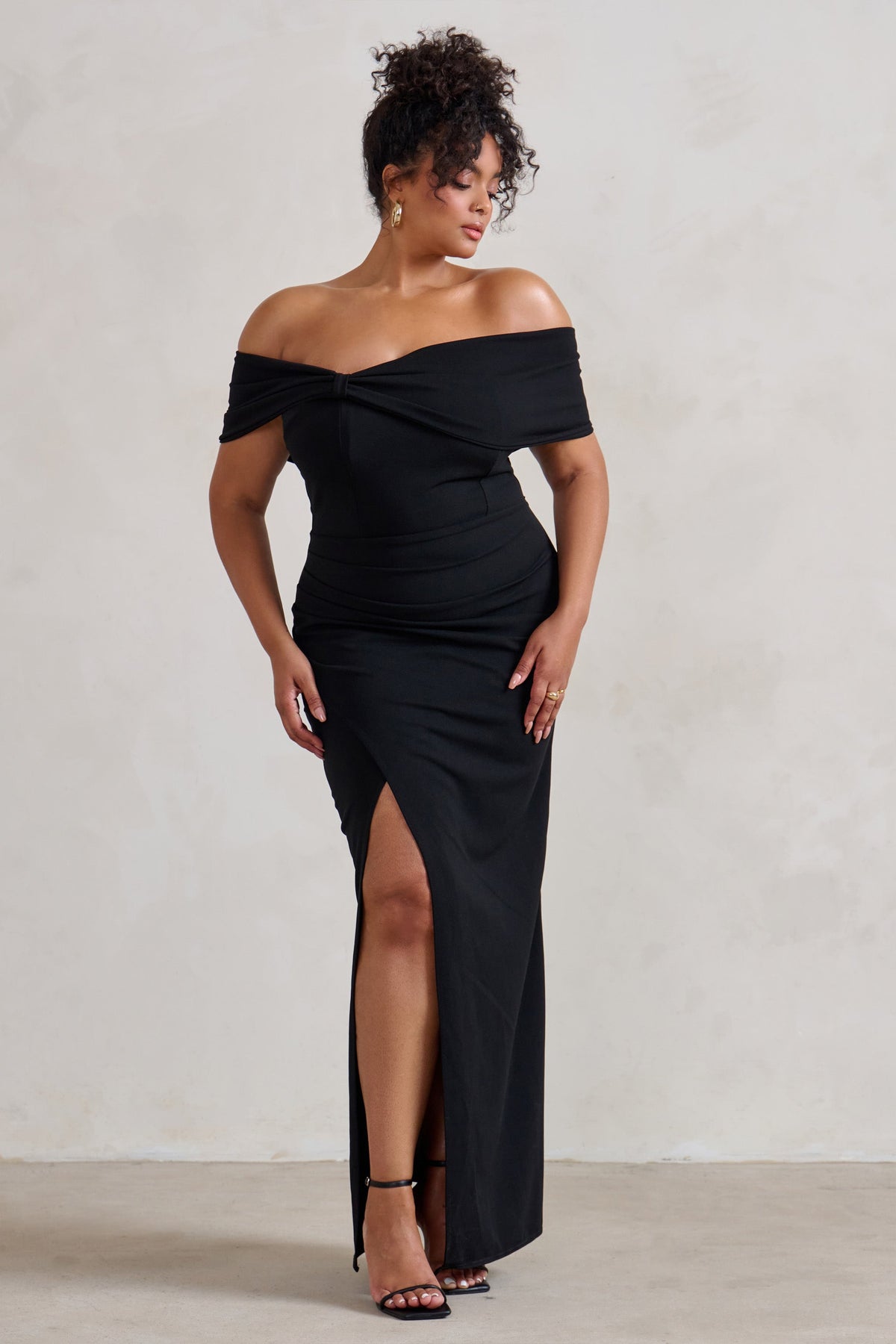 Eva | Robe longue noire bardot avec nœud et fente aux cuisses