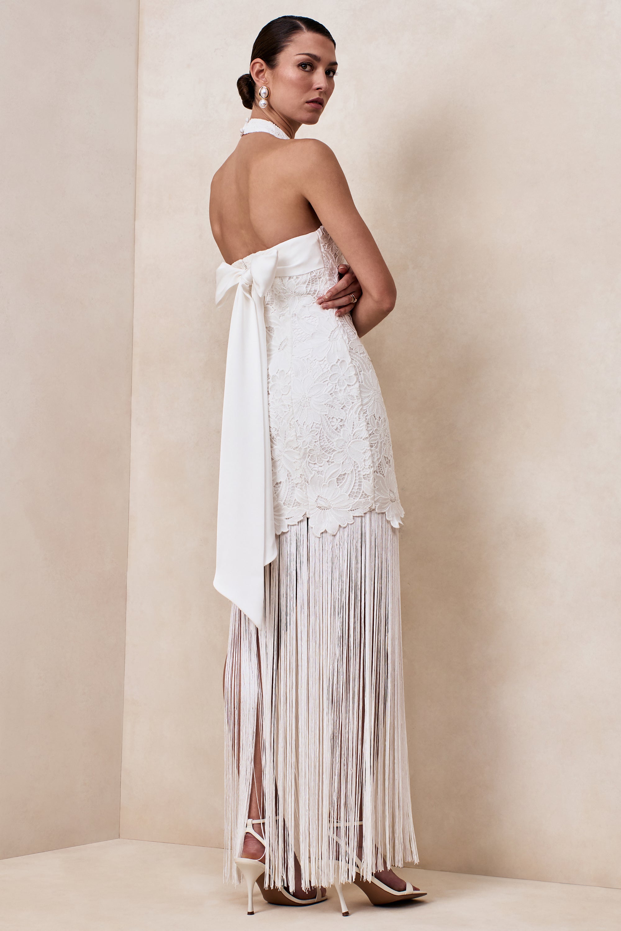 white lace dress with bow in back South Beach lace beach maxi dress with bow detail and back slit in cream