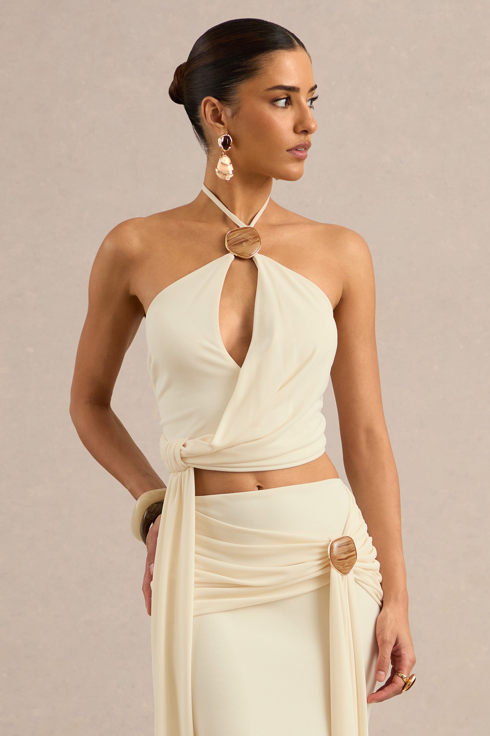 CL138404111 - Liviana | Cream Halter-Neck Top With Sash Detailing And Gold Detail2.jpg