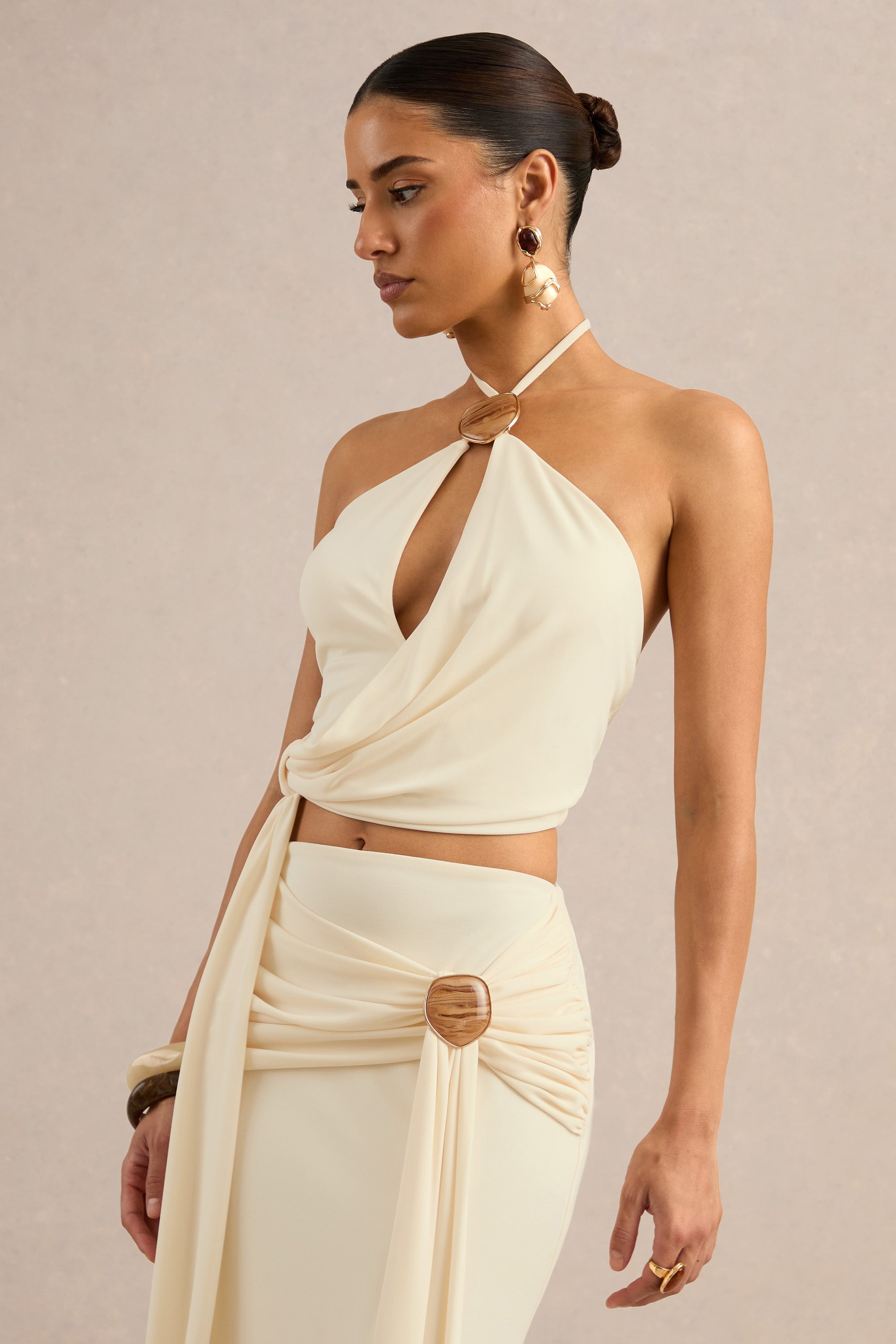 CL138404111 - Liviana | Cream Halter-Neck Top With Sash Detailing And Gold Detail3.jpg