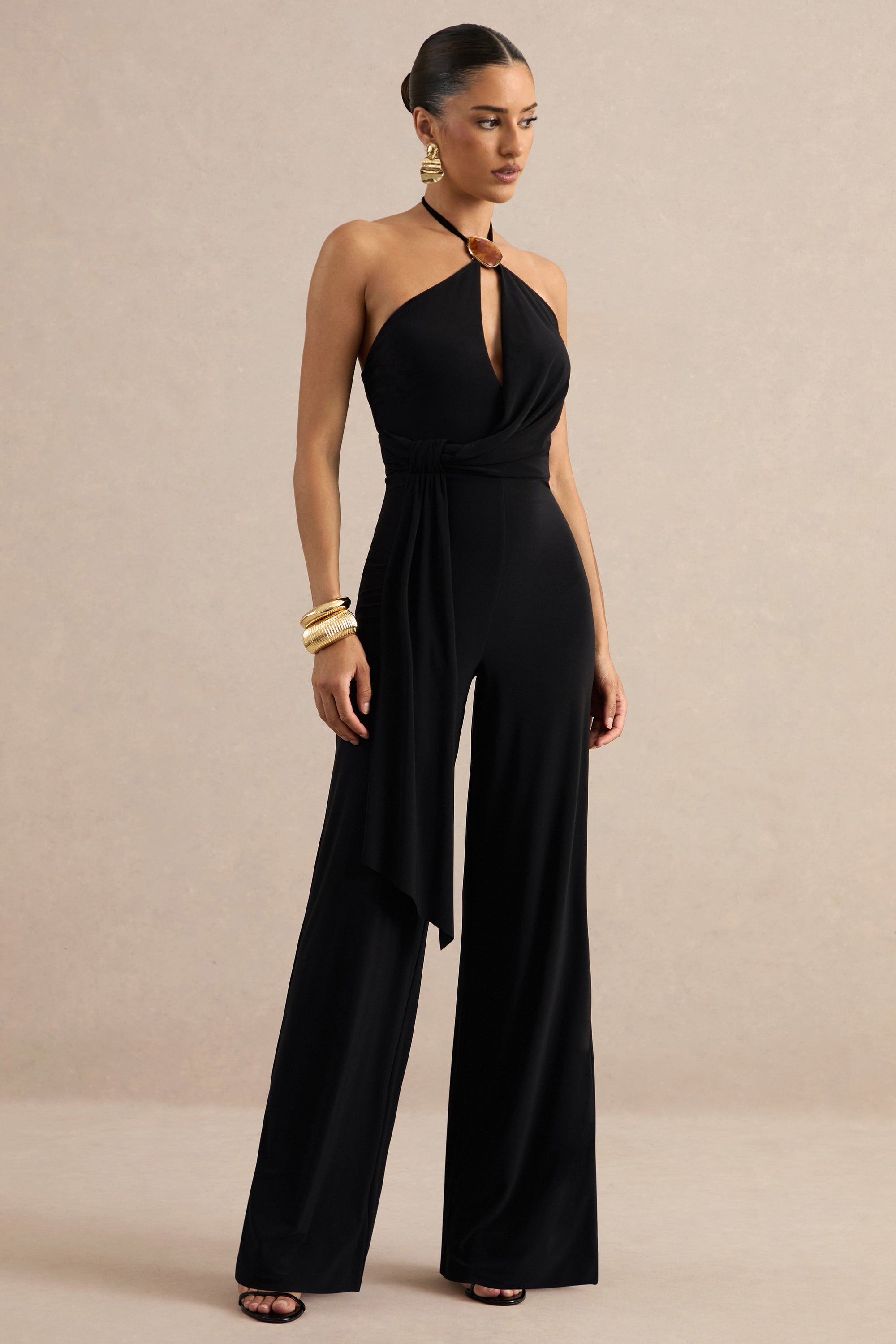 ECM_HR_CL138435001 - Avani | Black Halter-Neck Jumpsuit With Gathered Detailing And Gold Detail 1.jpg